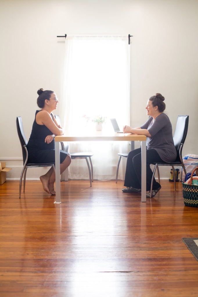 Lilly Mason Midwife sits with a client during a well-person consultation.